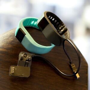 2 Smart Fitness Trackers in Black and Blue